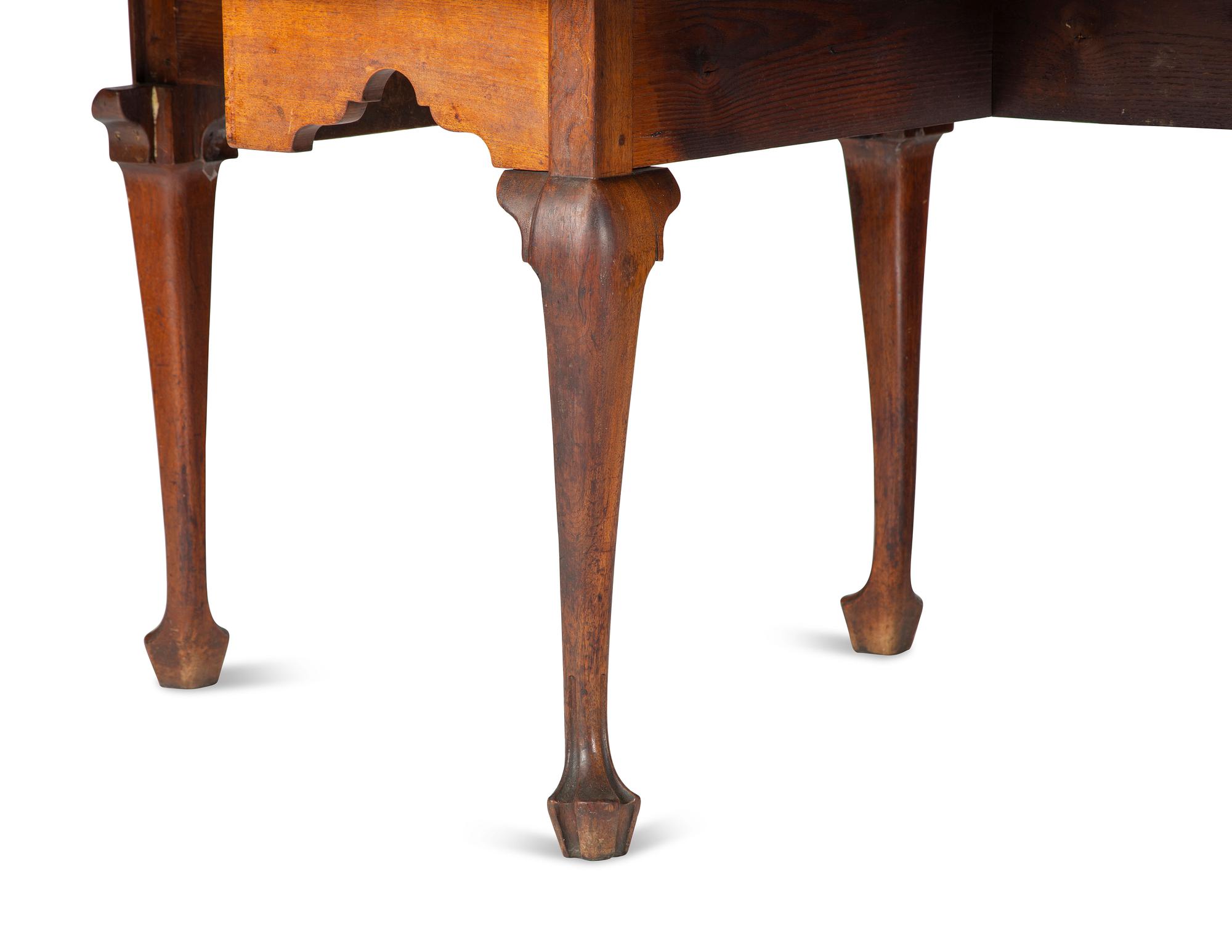 A Queen Anne Carved Walnut Drop-Leaf Dining Table