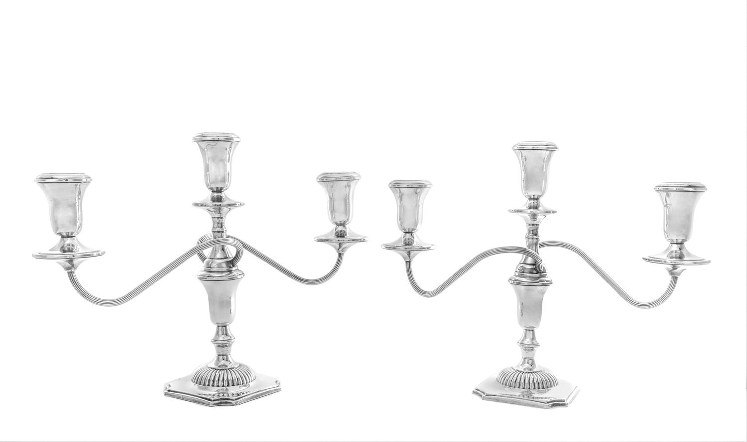 A Pair of American Silver Three-Light Candelabra, Reed & Barton, Taunton, MA, having two twist arms with reeded decoration issuing from