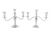 A Pair of American Silver Three-Light Candelabra, Reed & Barton, Taunton, MA, having two twist arms with reeded decoration issuing from