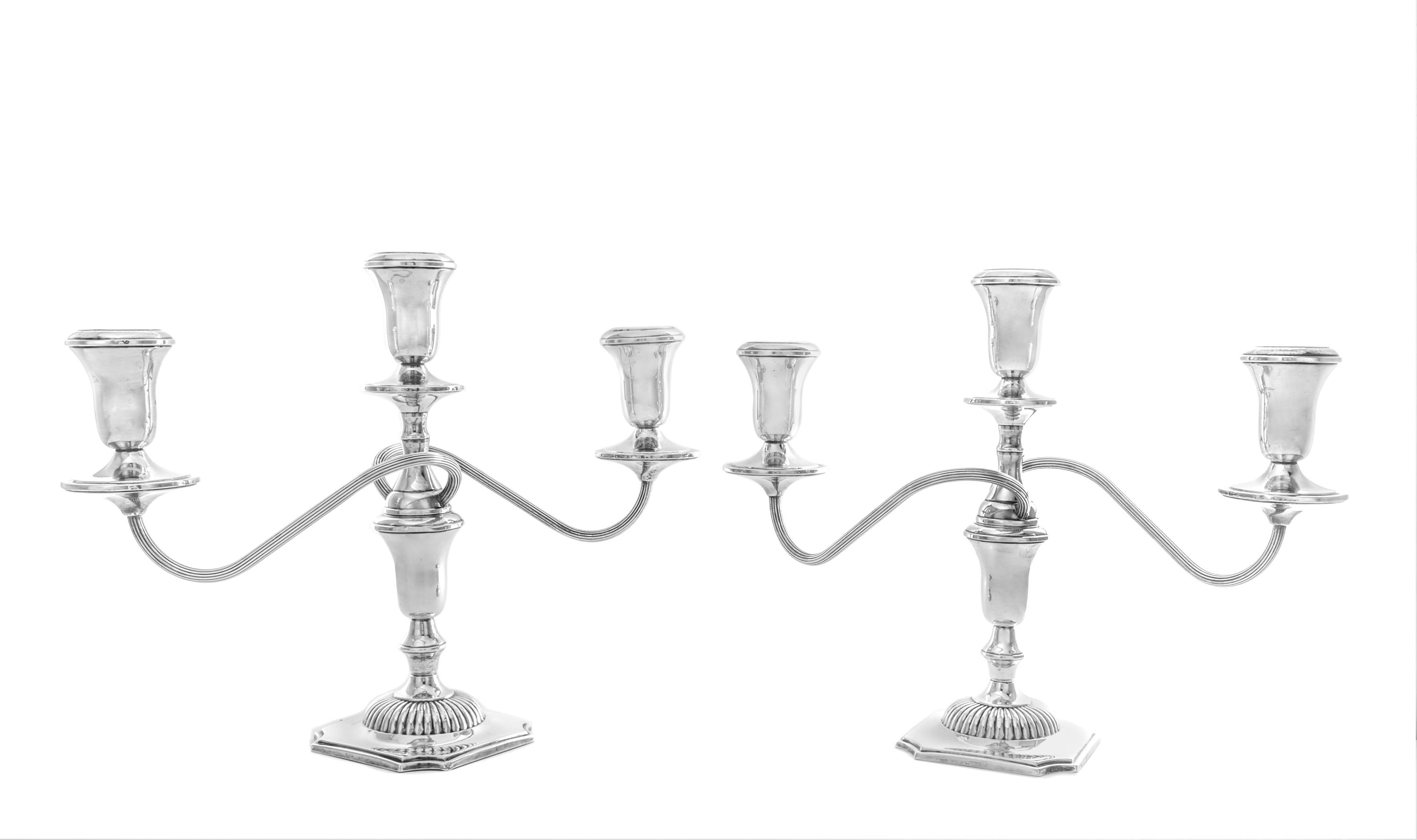 A Pair of American Silver Three-Light Candelabra, Reed & Barton, Taunton, MA, having two twist arms with reeded decoration issuing from
