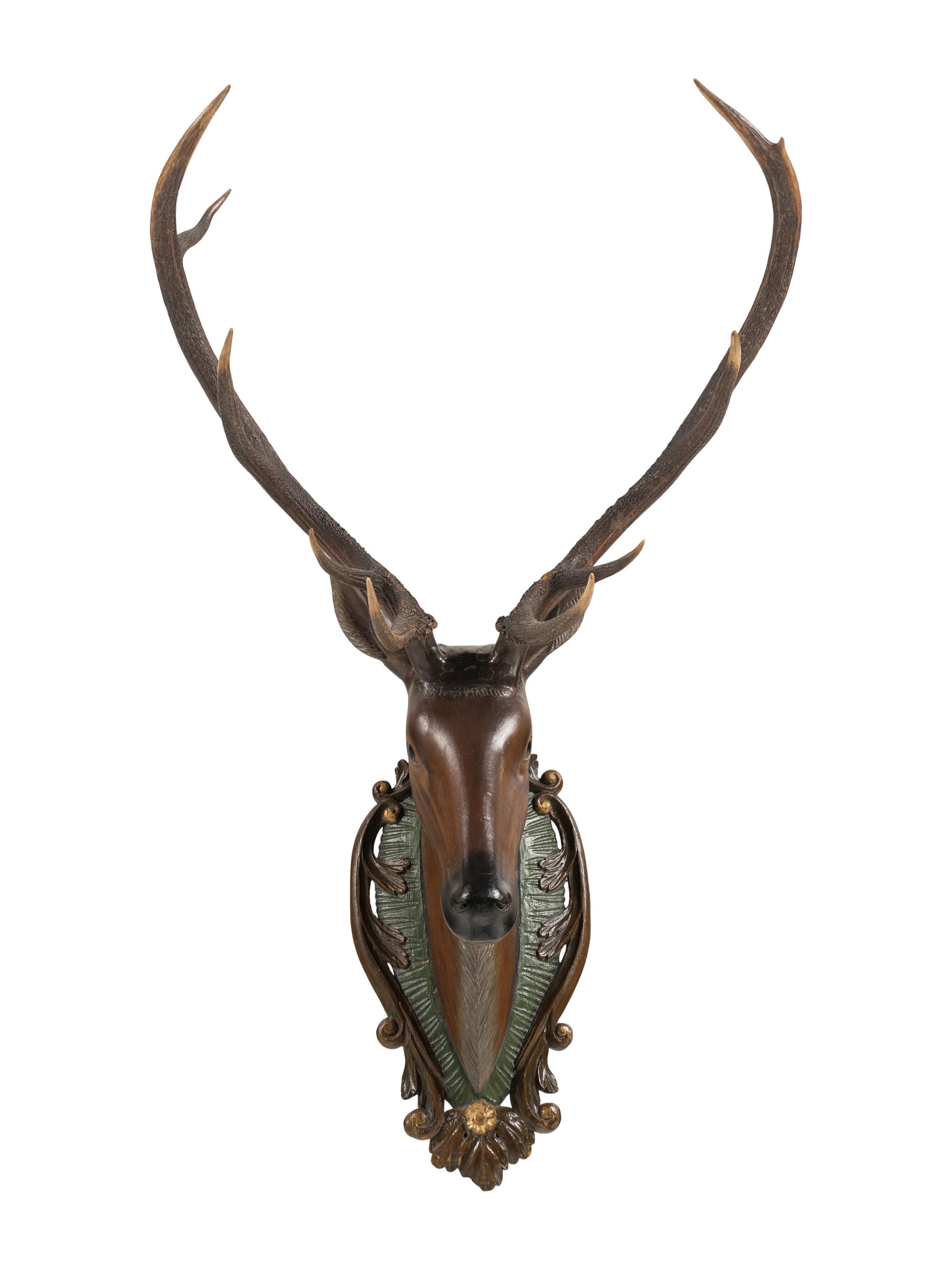 A Swiss 'Black Forest' Carved and Paint-Decorated Stag Head Trophy