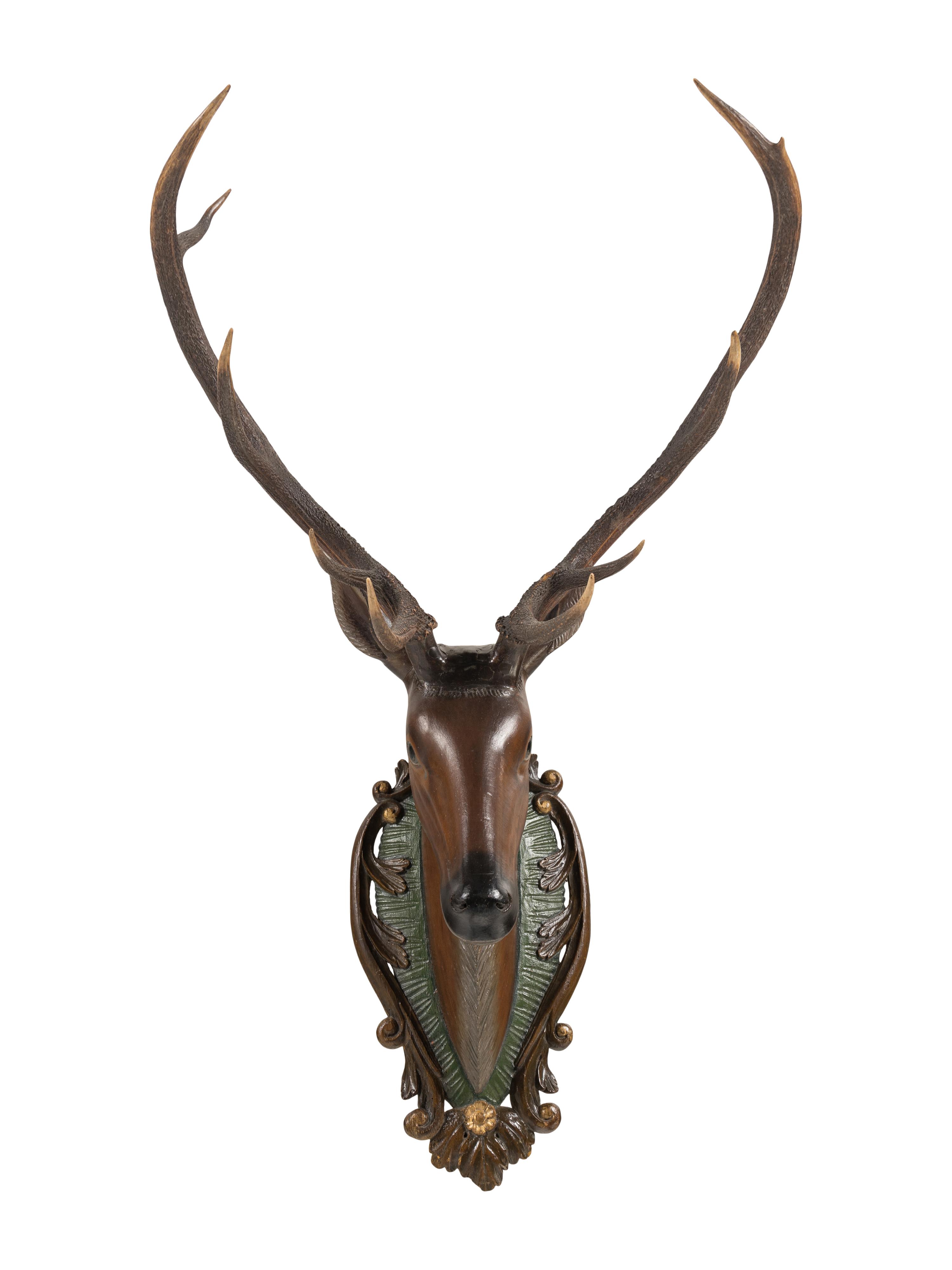 A Swiss 'Black Forest' Carved and Paint-Decorated Stag Head Trophy