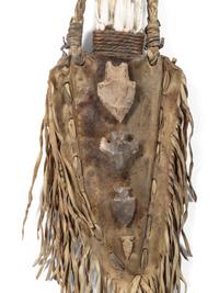 A Fringed Leather or Hide Bag with Attached Arrowheads