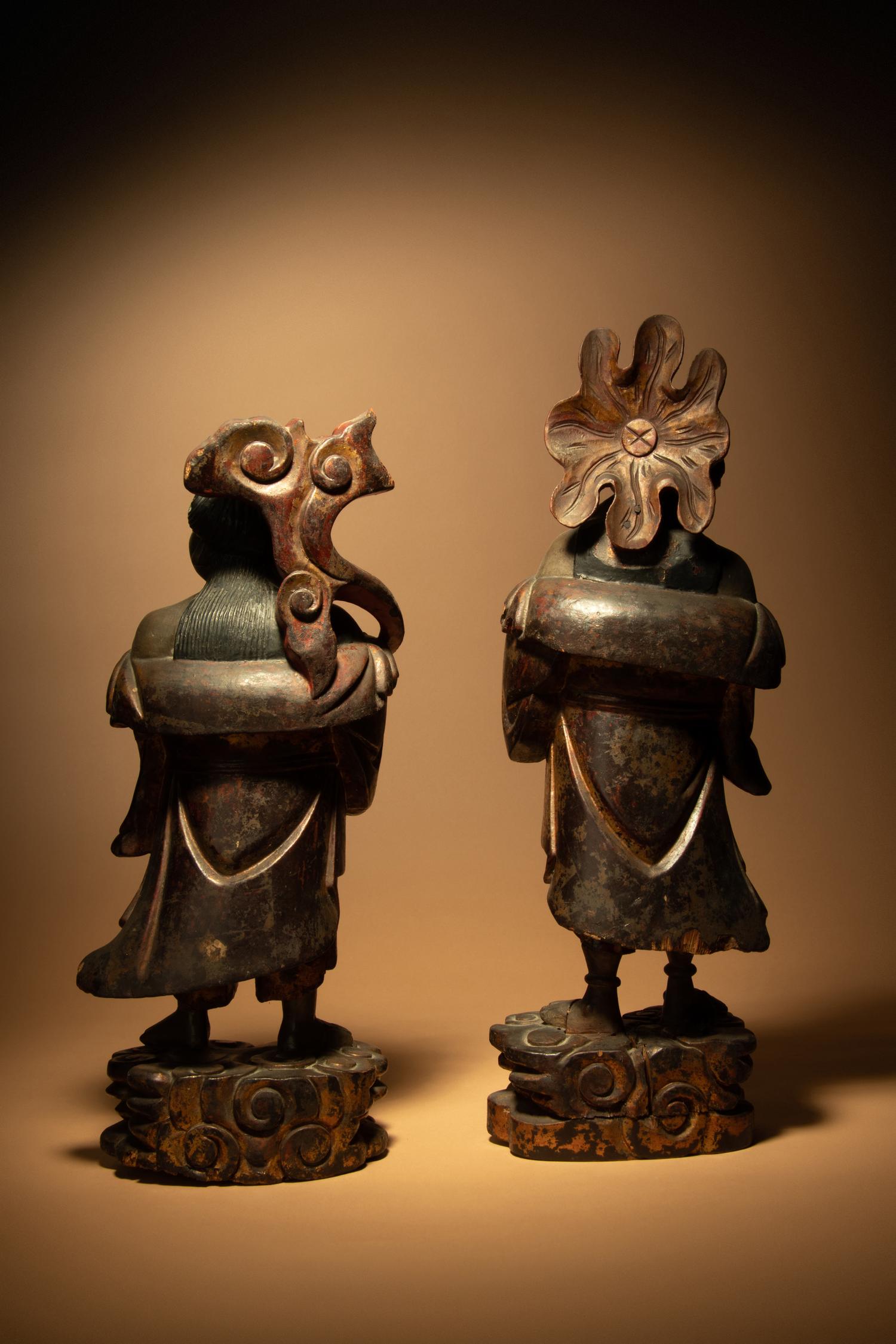 A Pair of Gilt and Lacquered Wood Figures of Immortals Hehe Erxian