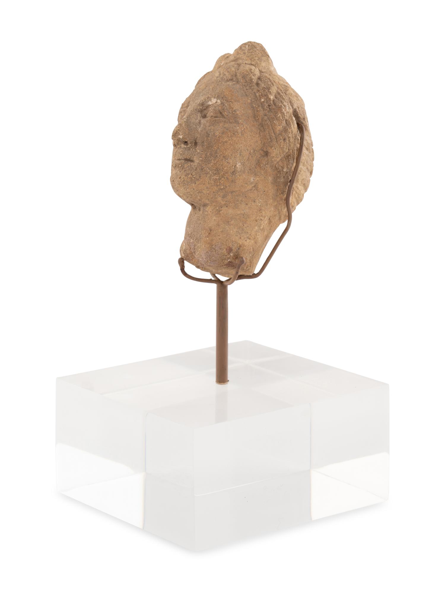 A Roman Stone Head of a Woman