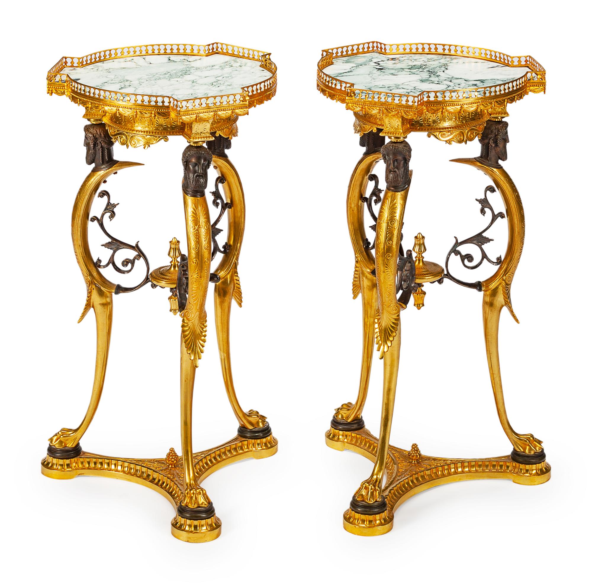 A Pair of Directoire Style Parcel-Gilt and Patinated Bronze Gueridons
