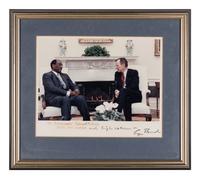 [PERKINS, Edward Joseph (1928-2020)]. A group of 9 documents or photographs by Presidents Nixon, Reagan, or Bush to Perkins, presumably with secretarial or facsimile signatures, including: