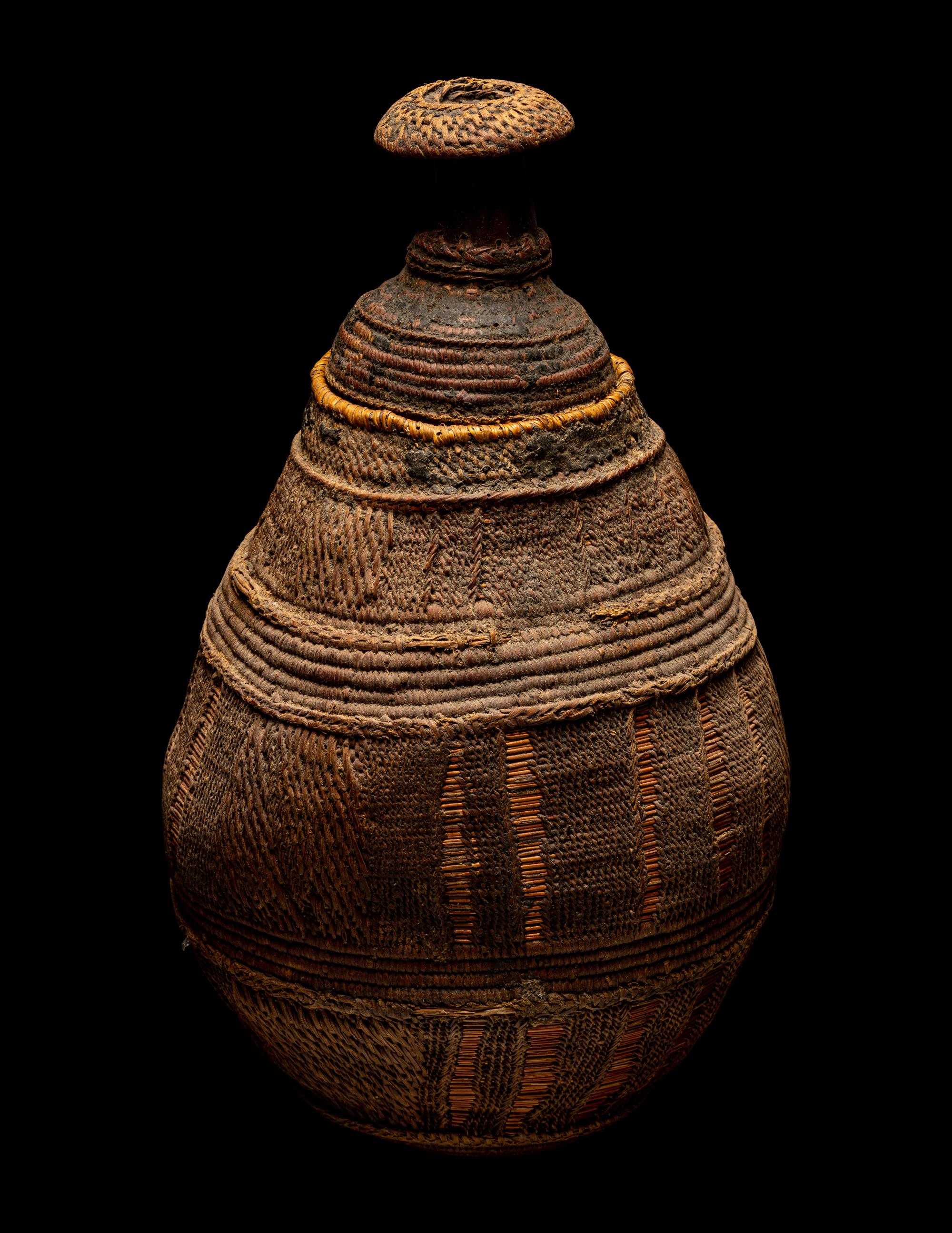 Eleven Oceanic and African Drums, Baskets, and Tools