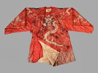 A Chinese Orange Ground Embroidered Silk Theatrical Dragon Robe