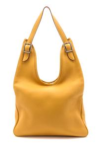 An Hermes Gold Leather Massai Bag, 17 1/2 x 10 x 2 1/2 inches.