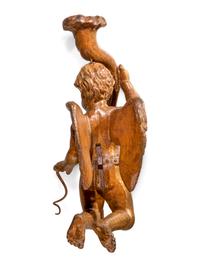 An Italian Carved Giltwood Figure of a Putto