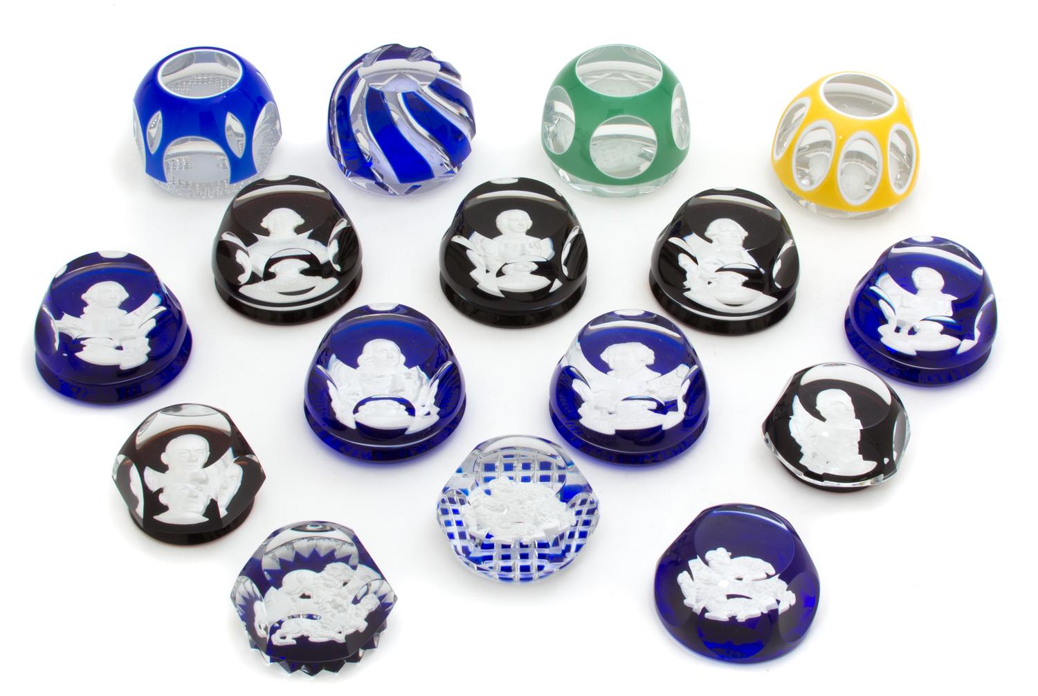 A Collection of Sixteen Baccarat Sulphide Paperweights Length of largest 3 1/2 inches. — 20TH CENTURY