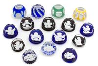A Collection of Sixteen Baccarat Sulphide Paperweights Length of largest 3 1/2 inches. — 20TH CENTURY