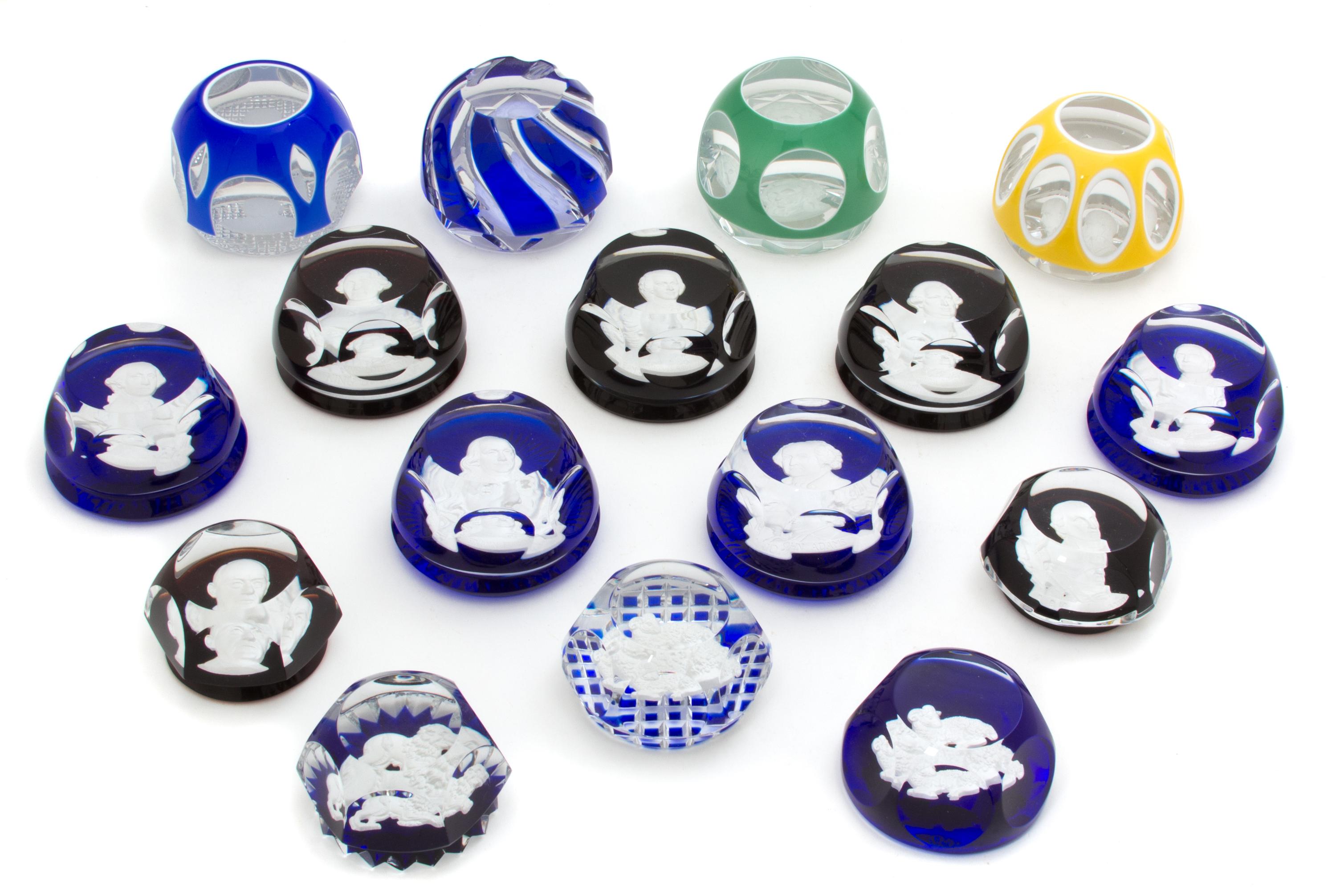 A Collection of Sixteen Baccarat Sulphide Paperweights Length of largest 3 1/2 inches. — 20TH CENTURY