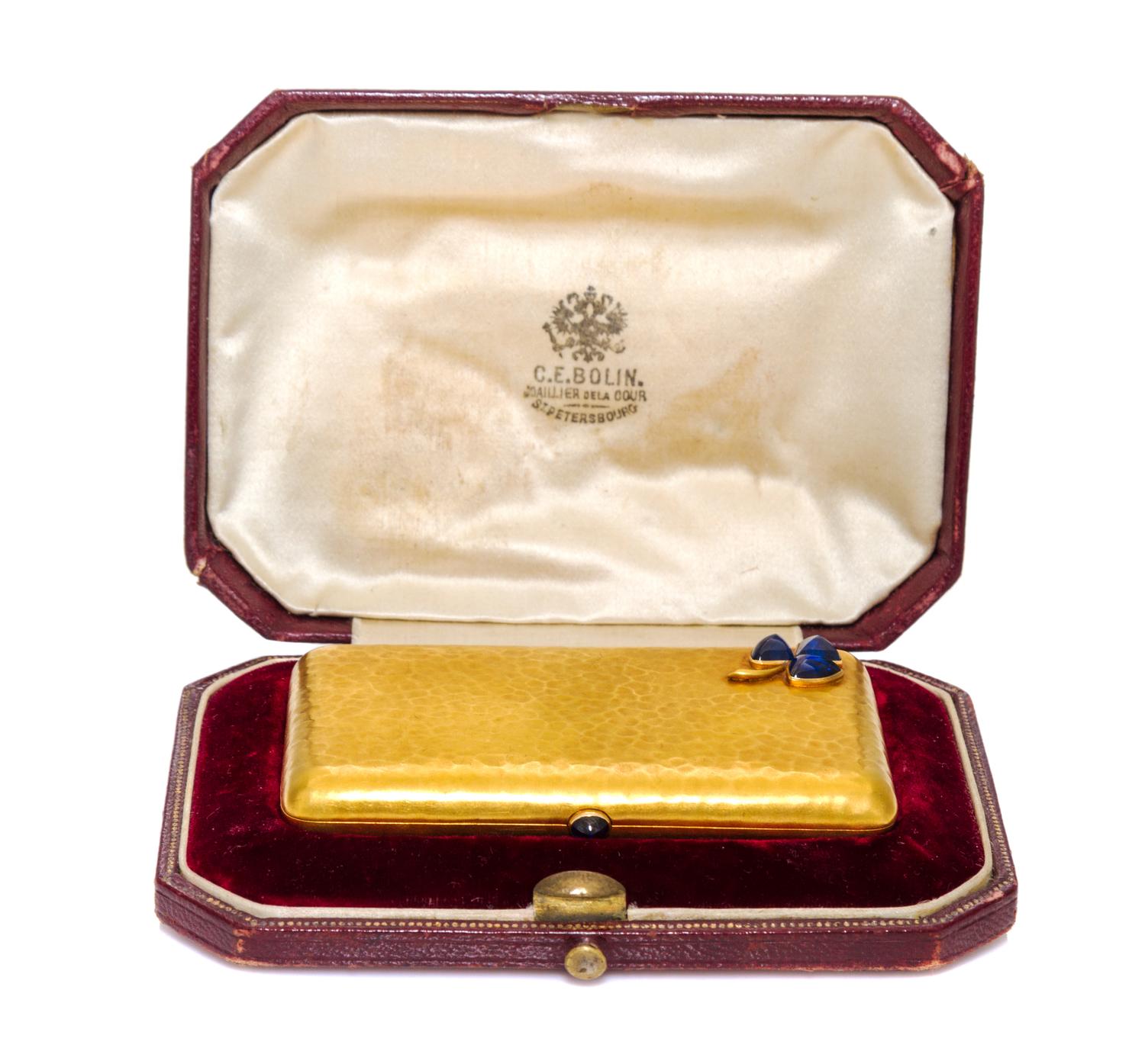 A Russian Gold and Sapphire Inset Cigarette Case, Edward Schramm, St. Petersburg, 19th/20th Century, of rectangular form with shamrock