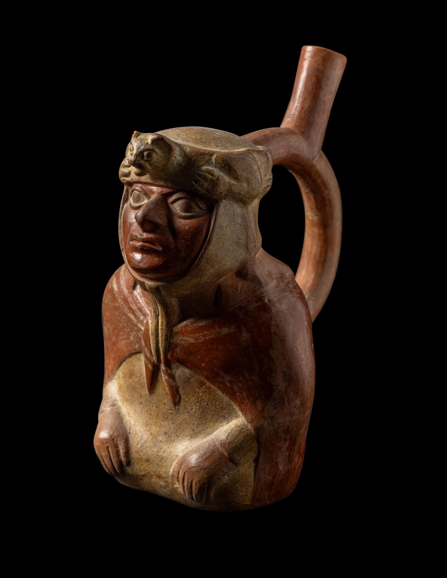 A Moche Stirrup Vessel in the Form of a Shaman with Feline Headdress