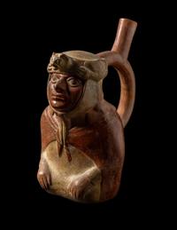 A Moche Stirrup Vessel in the Form of a Shaman with Feline Headdress