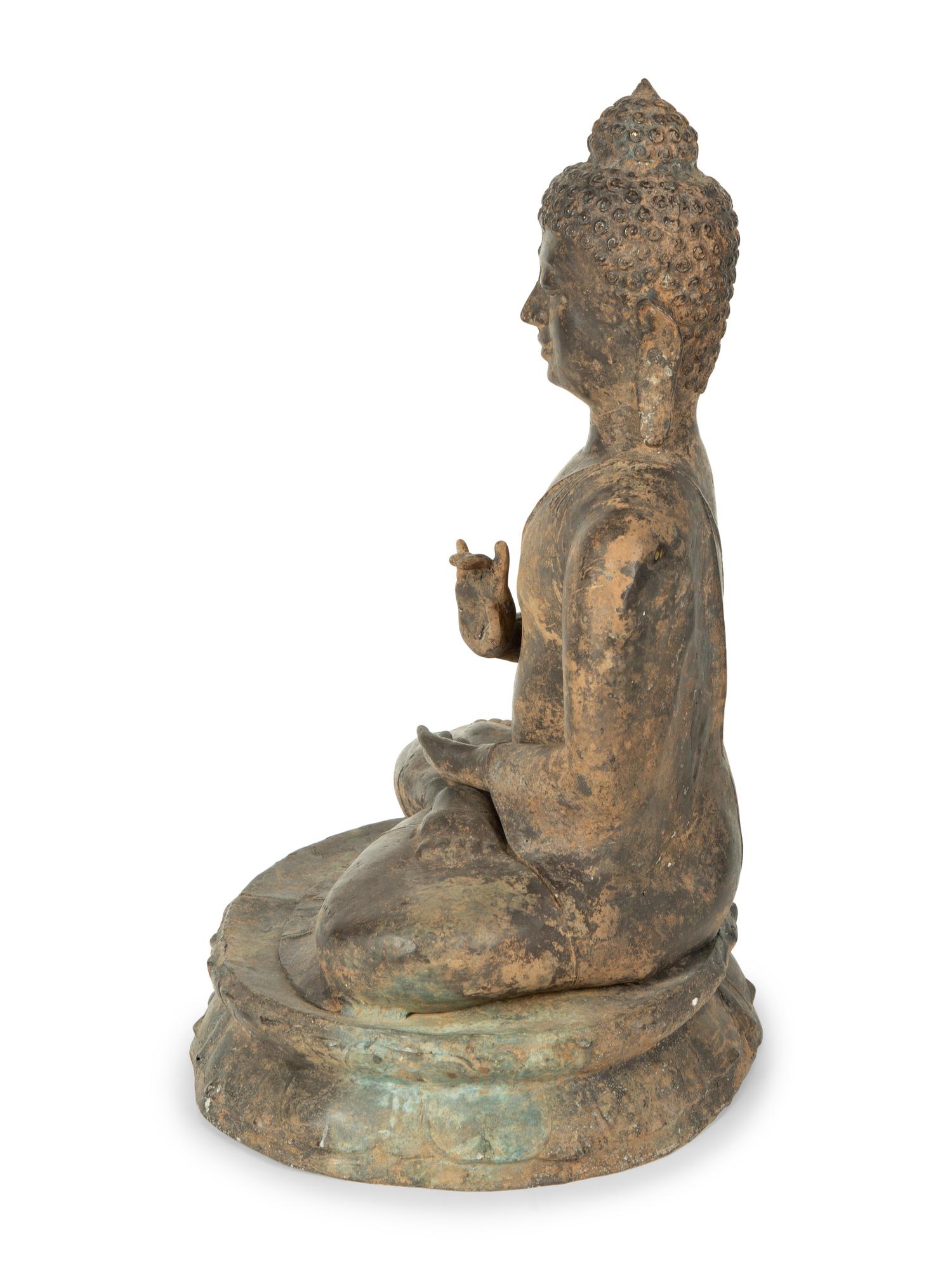A Patinated Bronze Seated Buddha