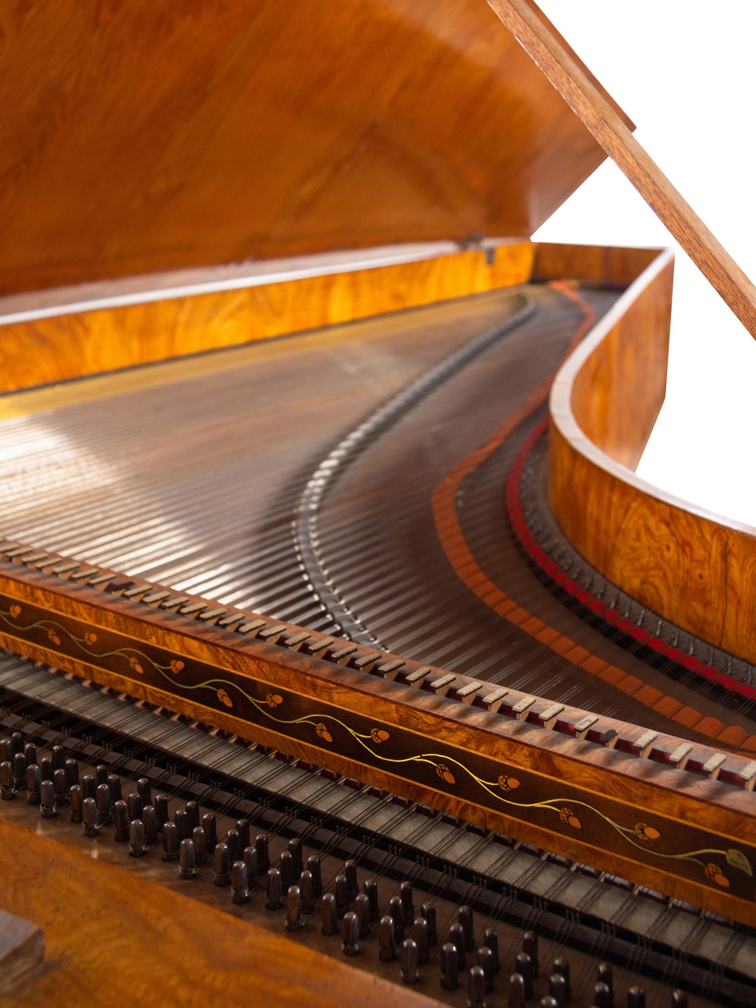An Austrian Enamel Inset Burlwood Harpsichord