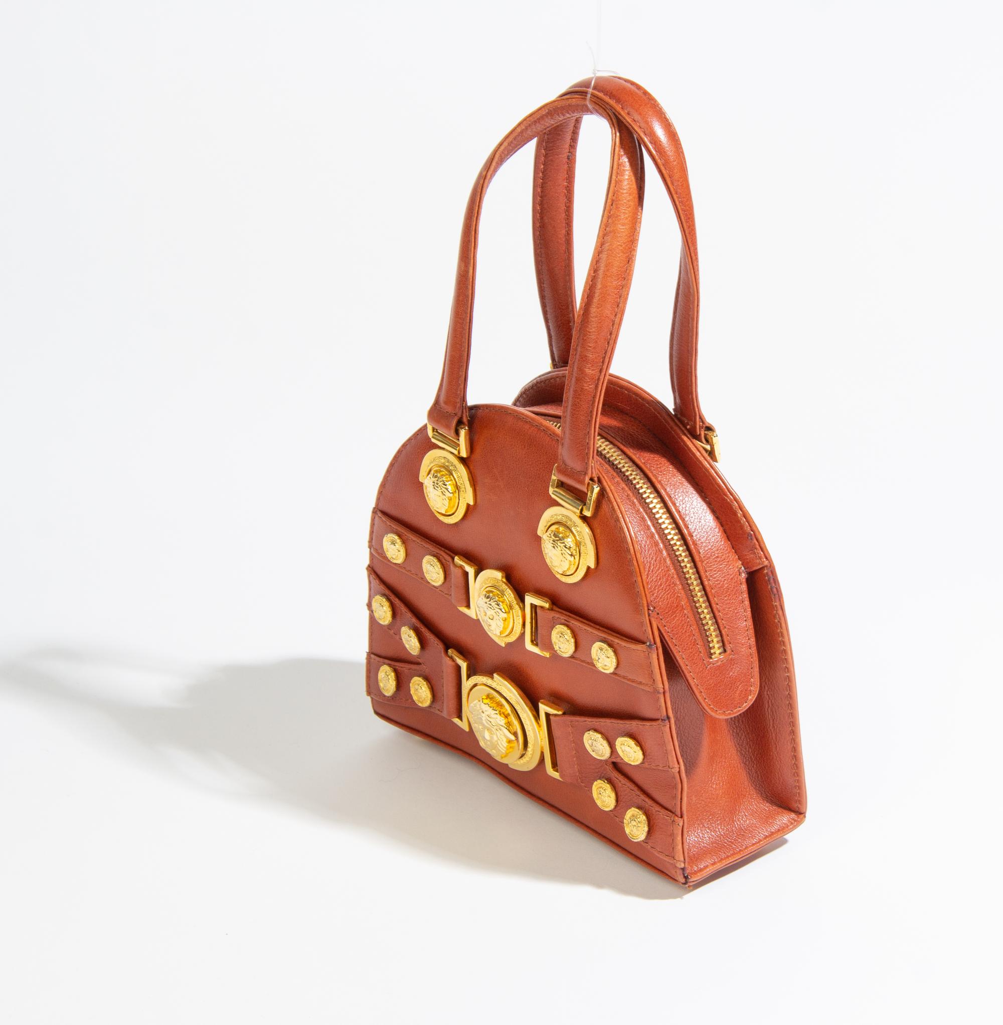 A Gianni Versace Brown Leather Mini Medusa Handbag, 7" x 6.5" x 2.5".