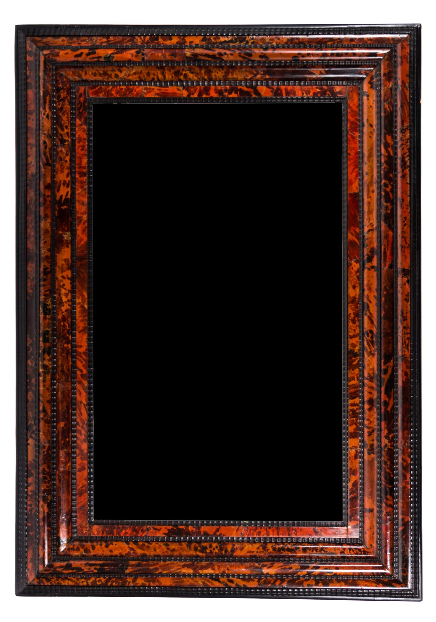 A Flemish Tortoise Shell and Ebonized Mirror 63 1/2 x 38 inches.