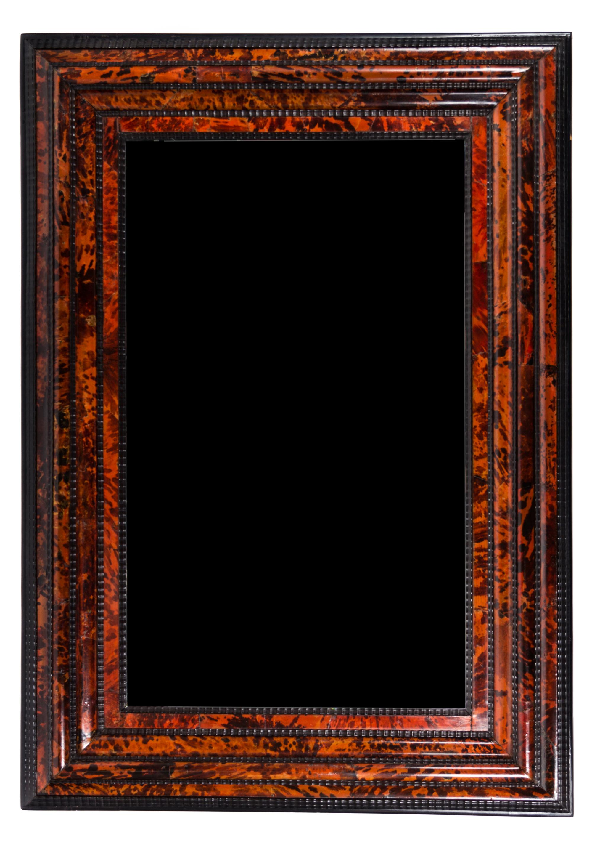A Flemish Tortoise Shell and Ebonized Mirror 63 1/2 x 38 inches.