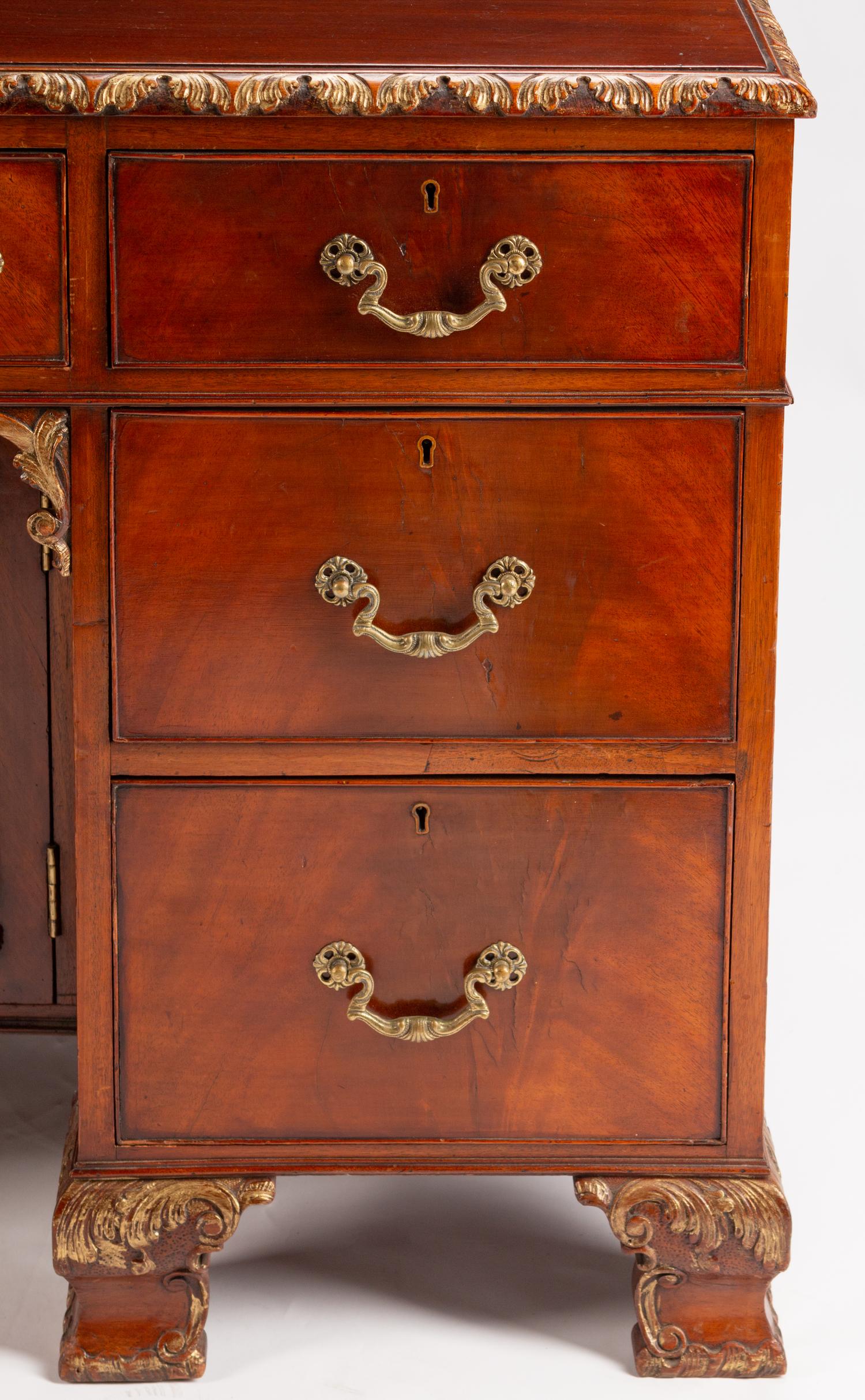 A George III Style Parcel-Gilt Mahogany Kneehole Desk — LATE 19TH/EARLY 20TH CENTURY