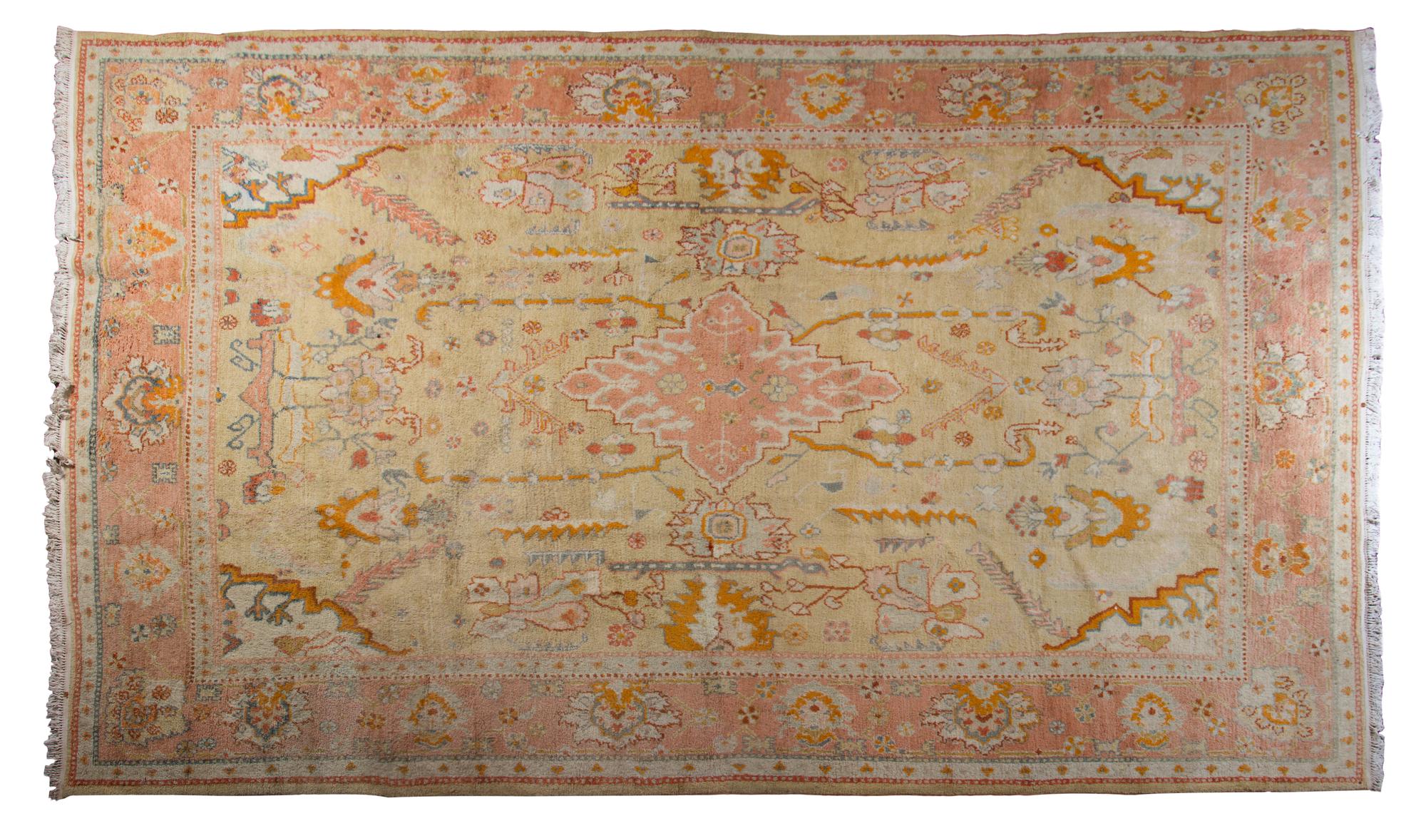 An Oushak Wool Carpet, CIRCA 1900, Length 12 feet 8 inches x width 10 feet 3 inches. — CIRCA 1900