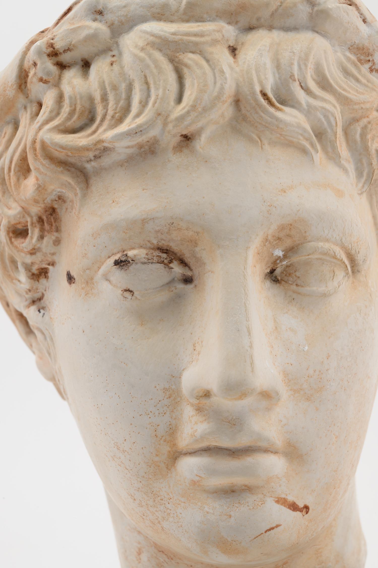 A Roman Style Plaster Head of a Youth
