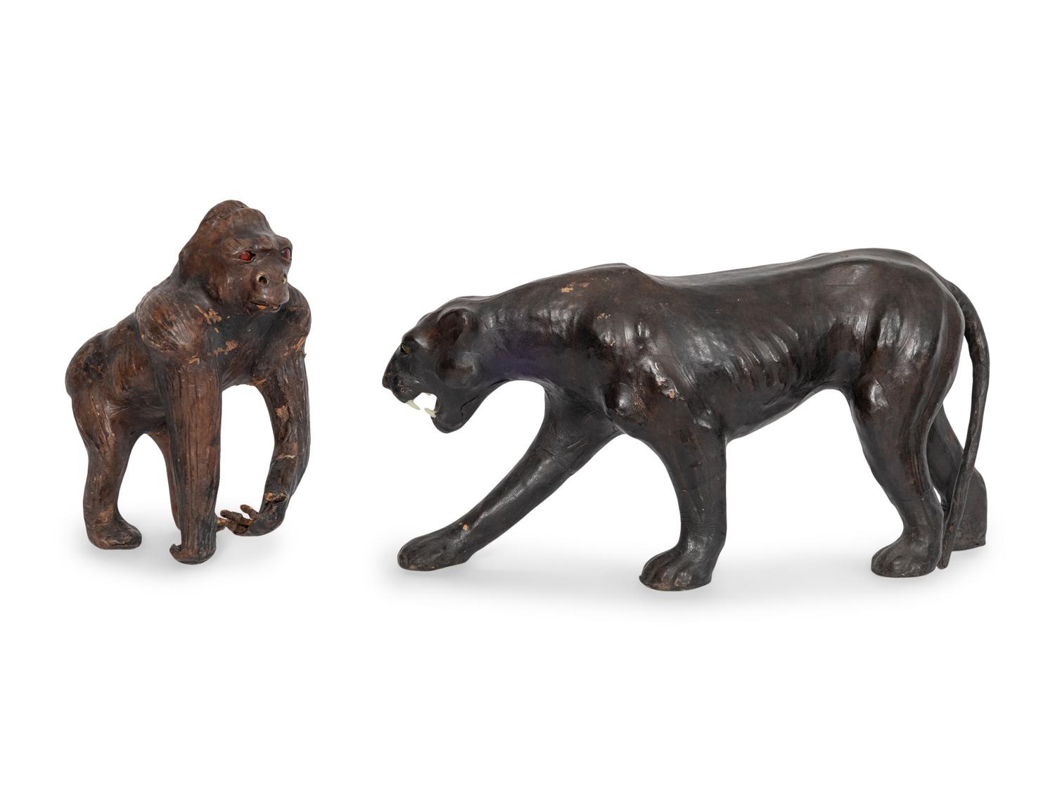 Two Leather Clad Animal Figures