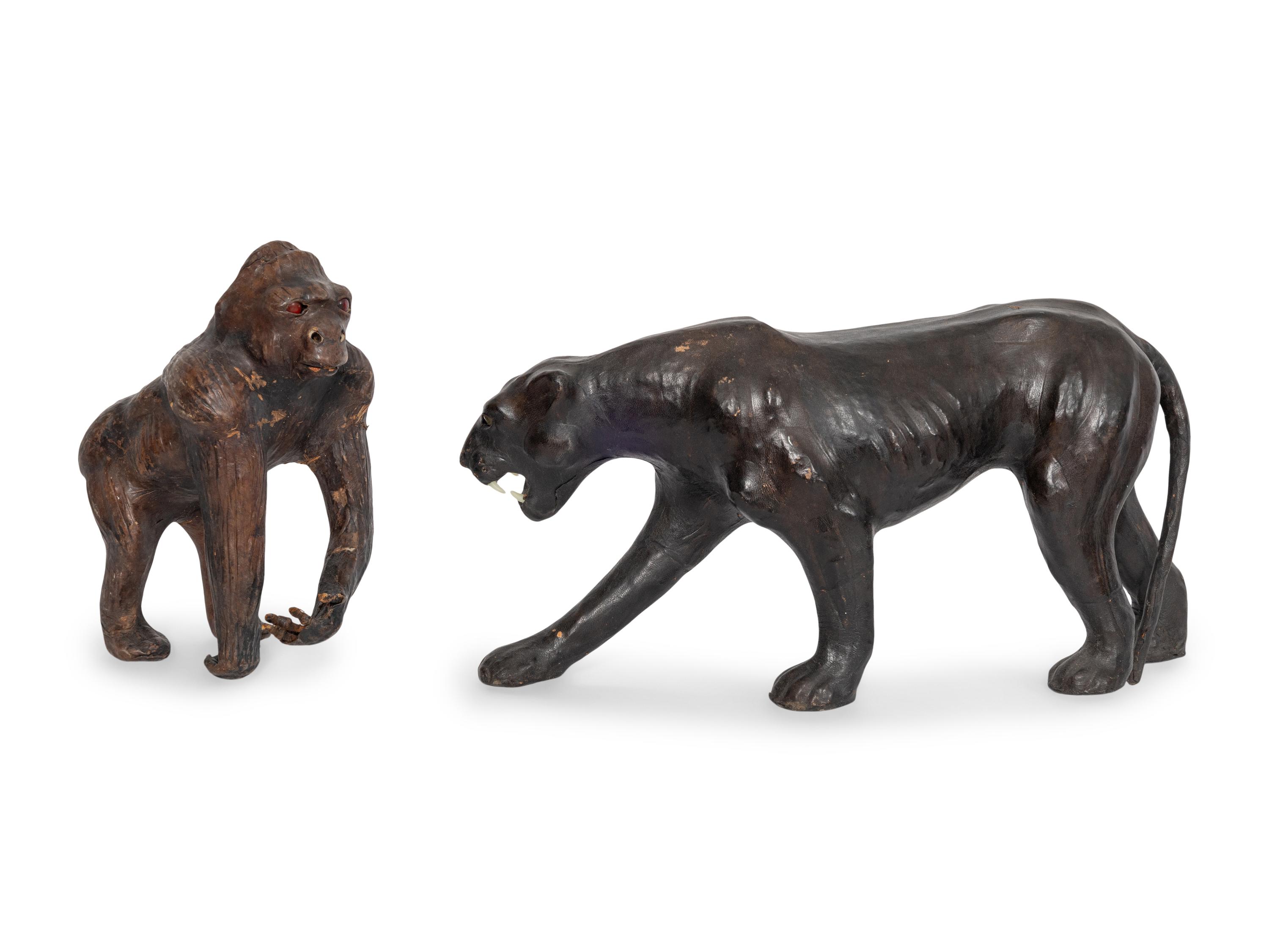 Two Leather Clad Animal Figures