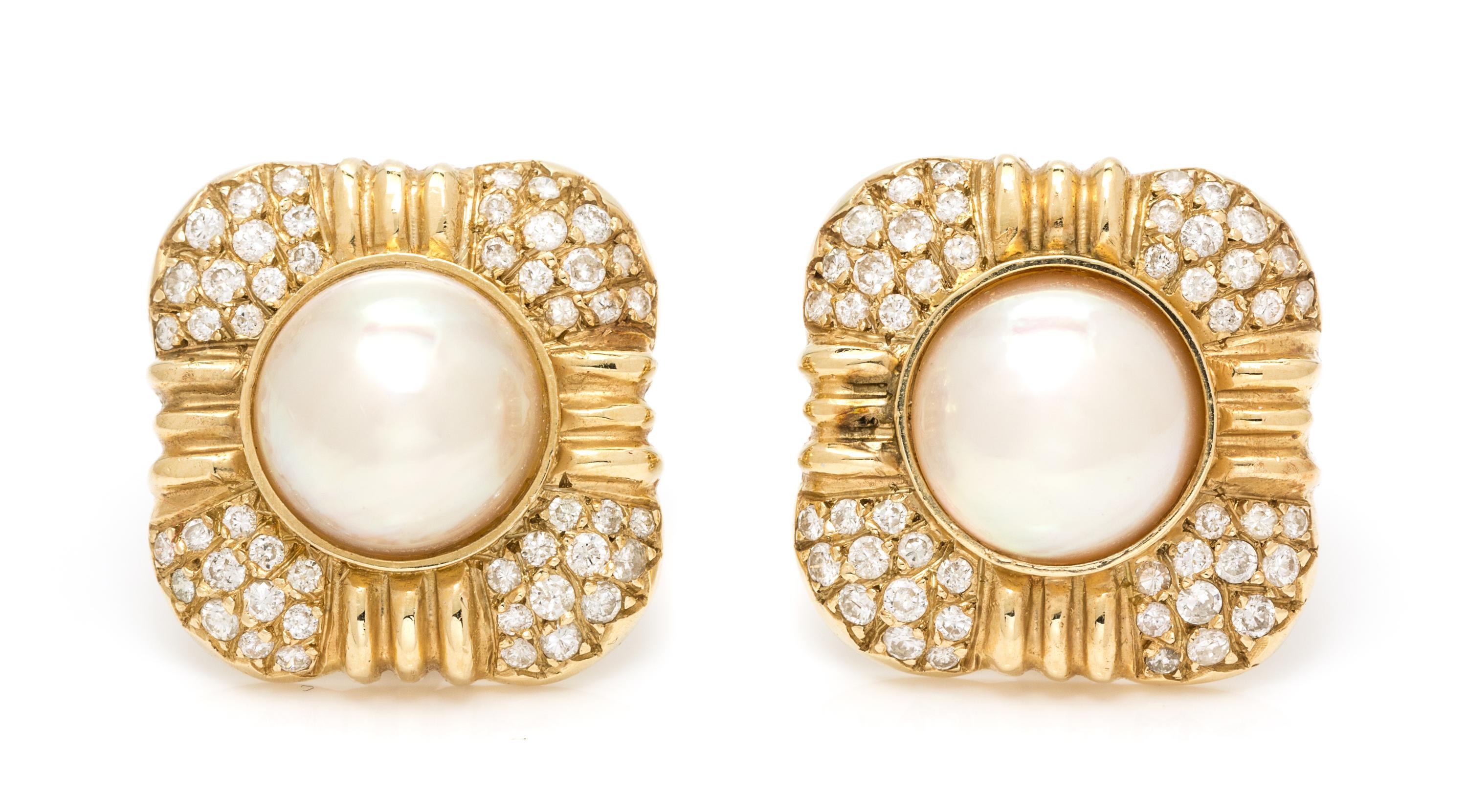 A Pair of 14 Karat Yellow Gold, Mabe Pearl and Diamond Earclips, 11.60 dwts.