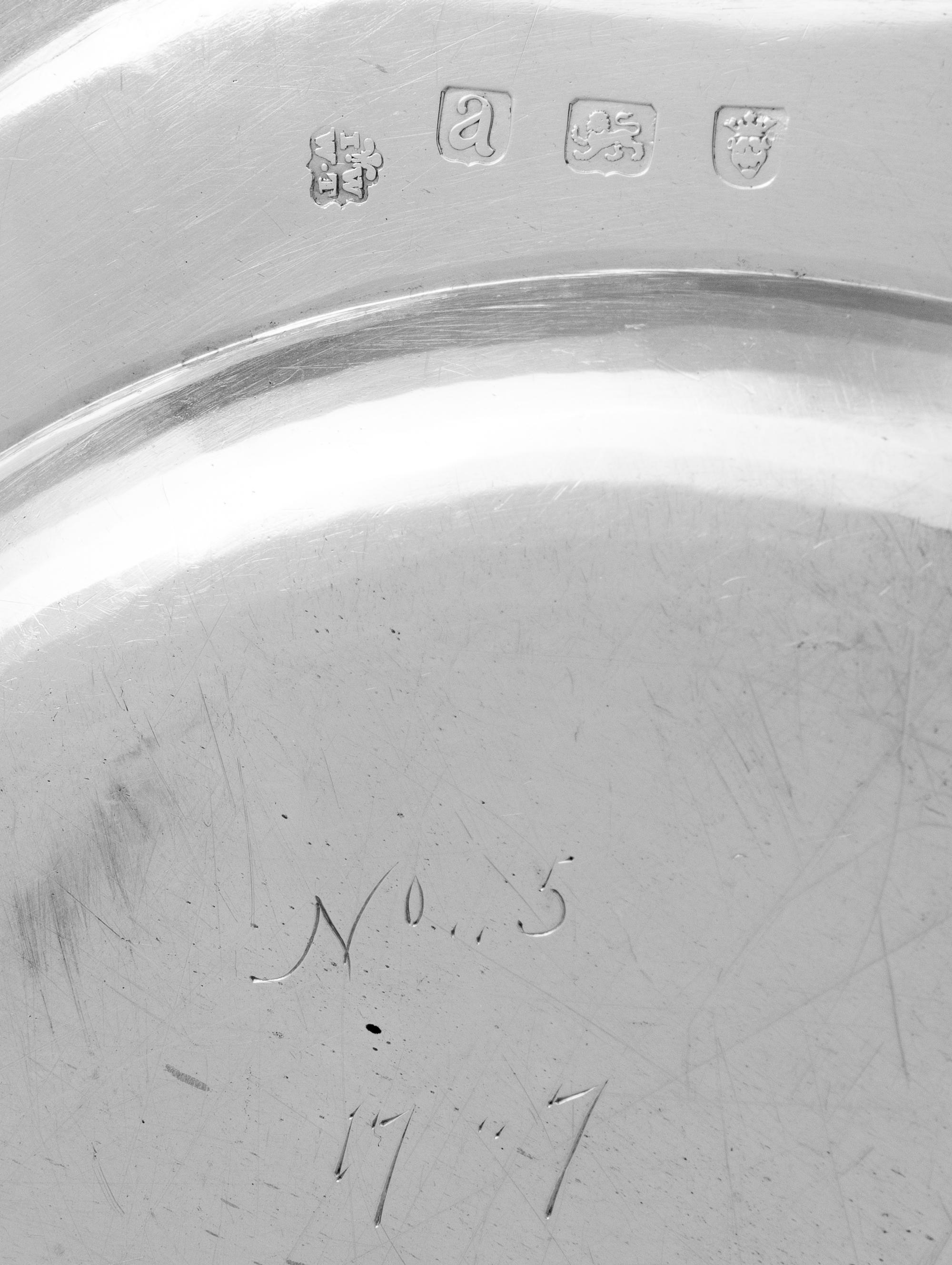 A Set of Ten George III Silver Dinner Plates