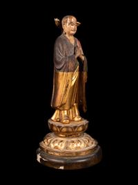 A Polychrome and Gilt Painted Wood Figure of a Standing Monk