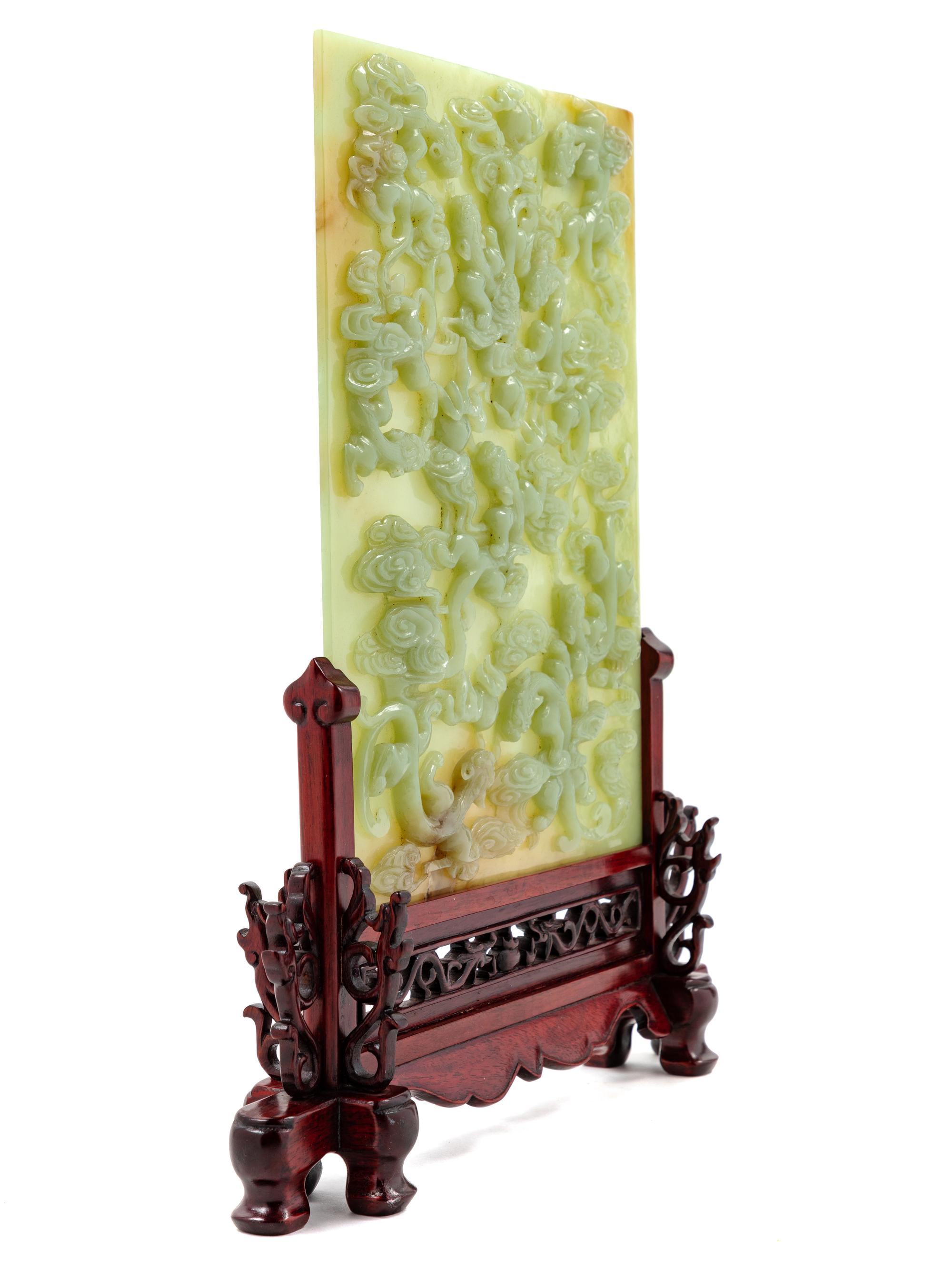 A Chinese Yellow Celadon Jade 'Chilong' Table Screen