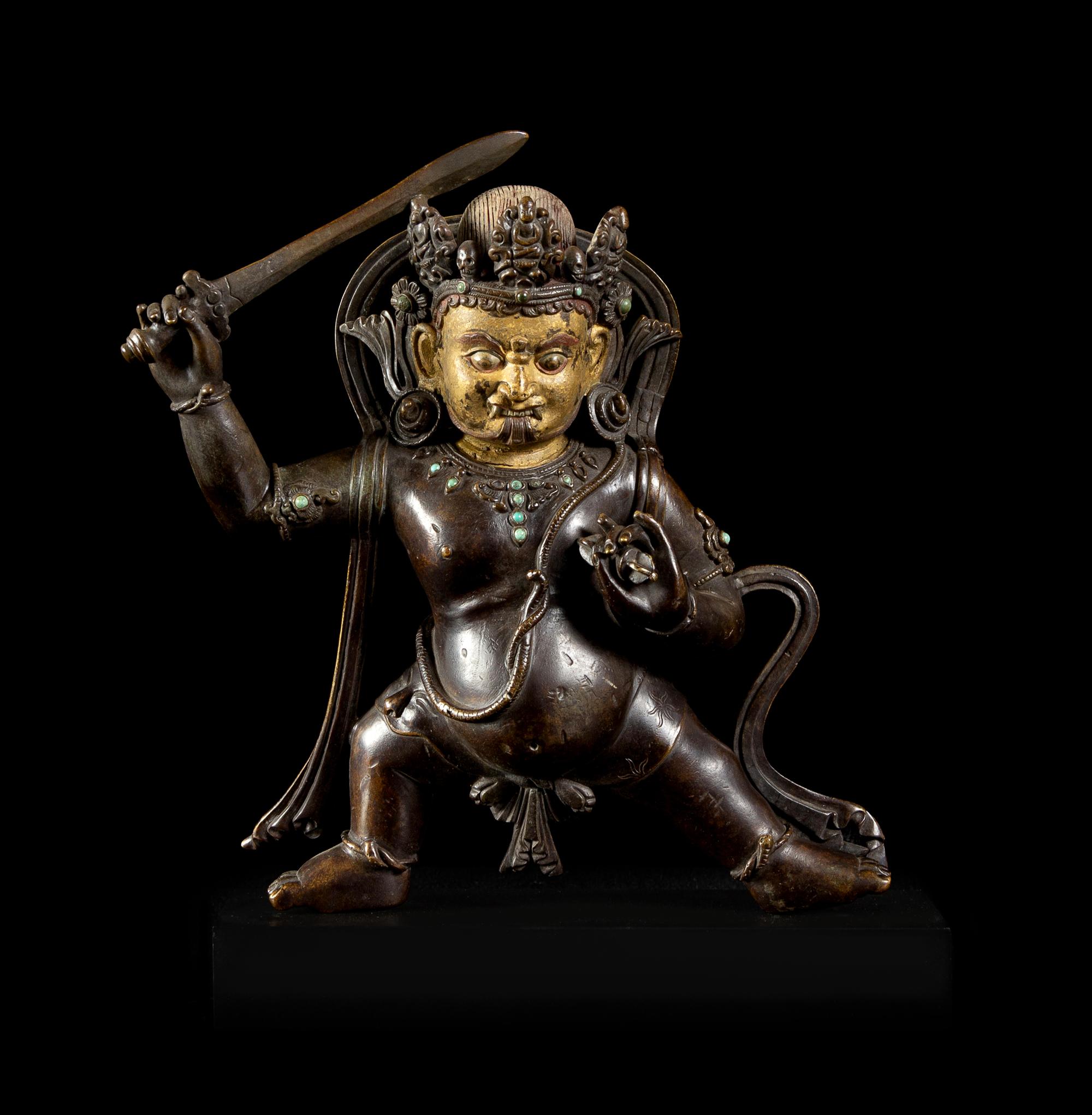 A Sino-Tibetan Parcel-Gilt Bronze Figure of Jambhala