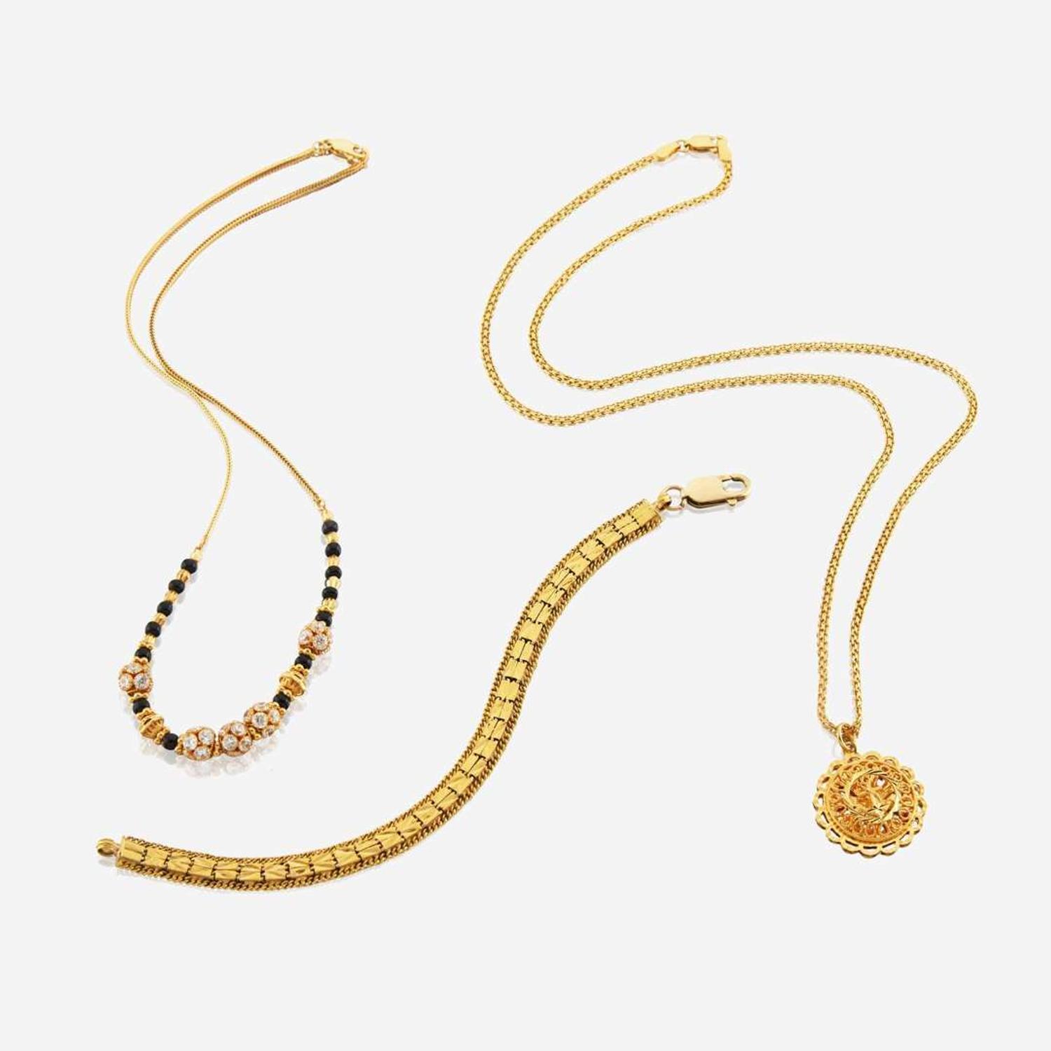 A collection of high karat gold jewelry