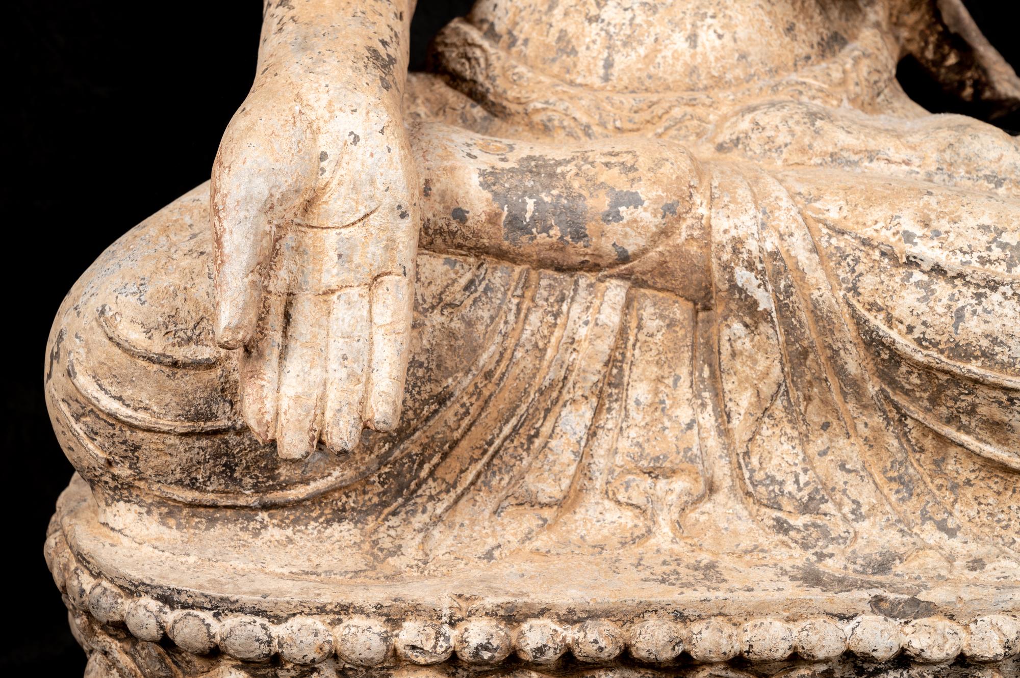 A Chinese Carved Stone Seated Buddha