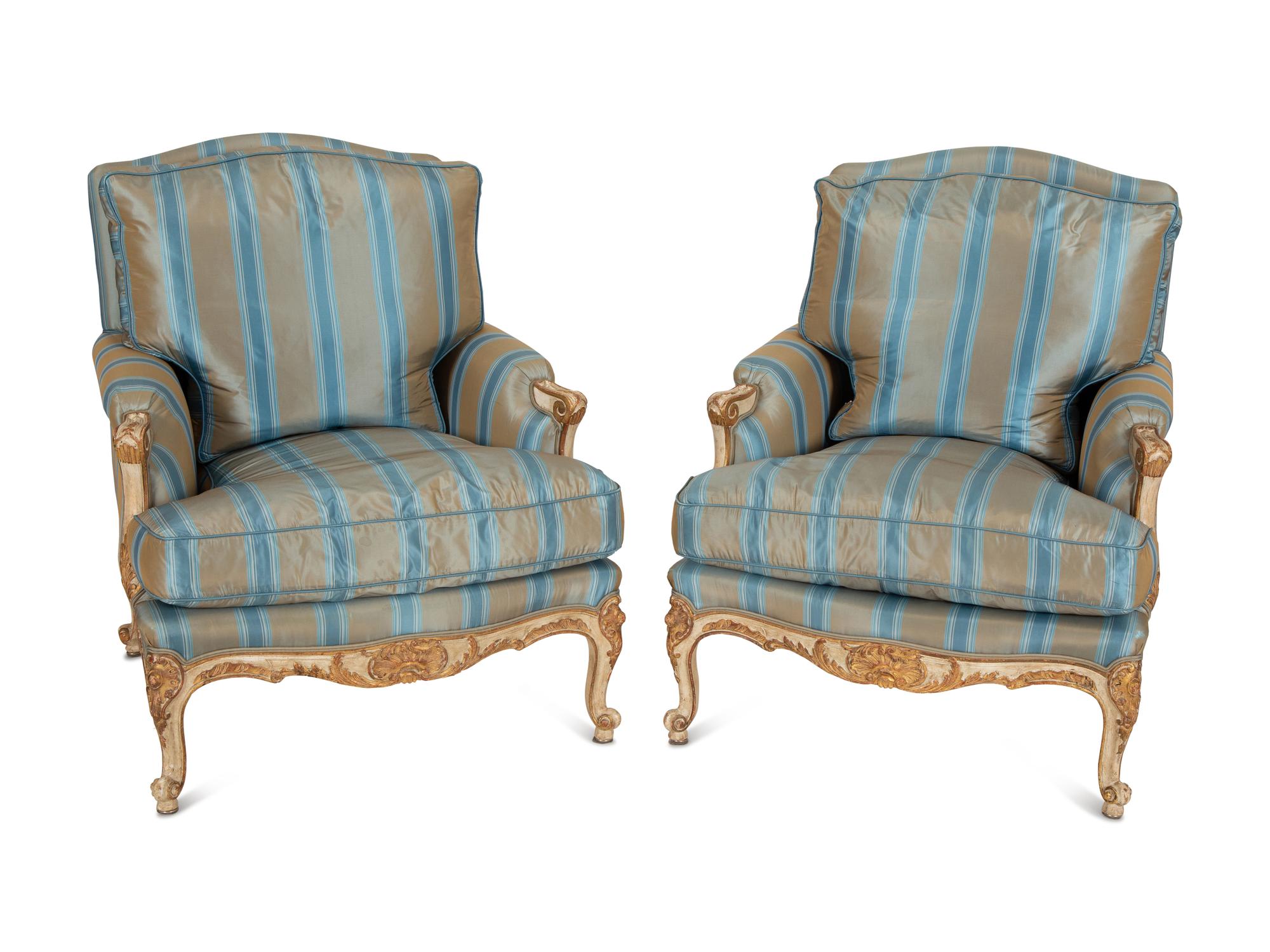 A Pair of Louis XV Style Painted and Parcel Gilt Bergeres