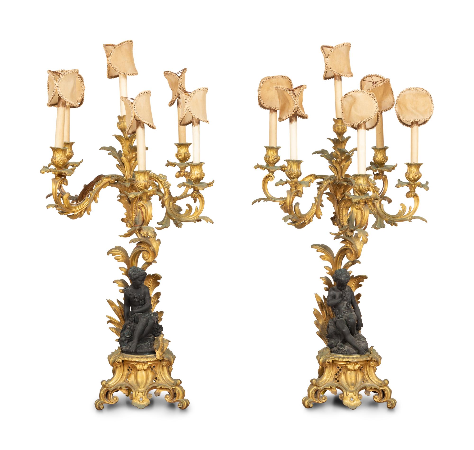 A Pair of Louis XV Style Gilt and Patinated Bronze Figural Six-Light Candelabra