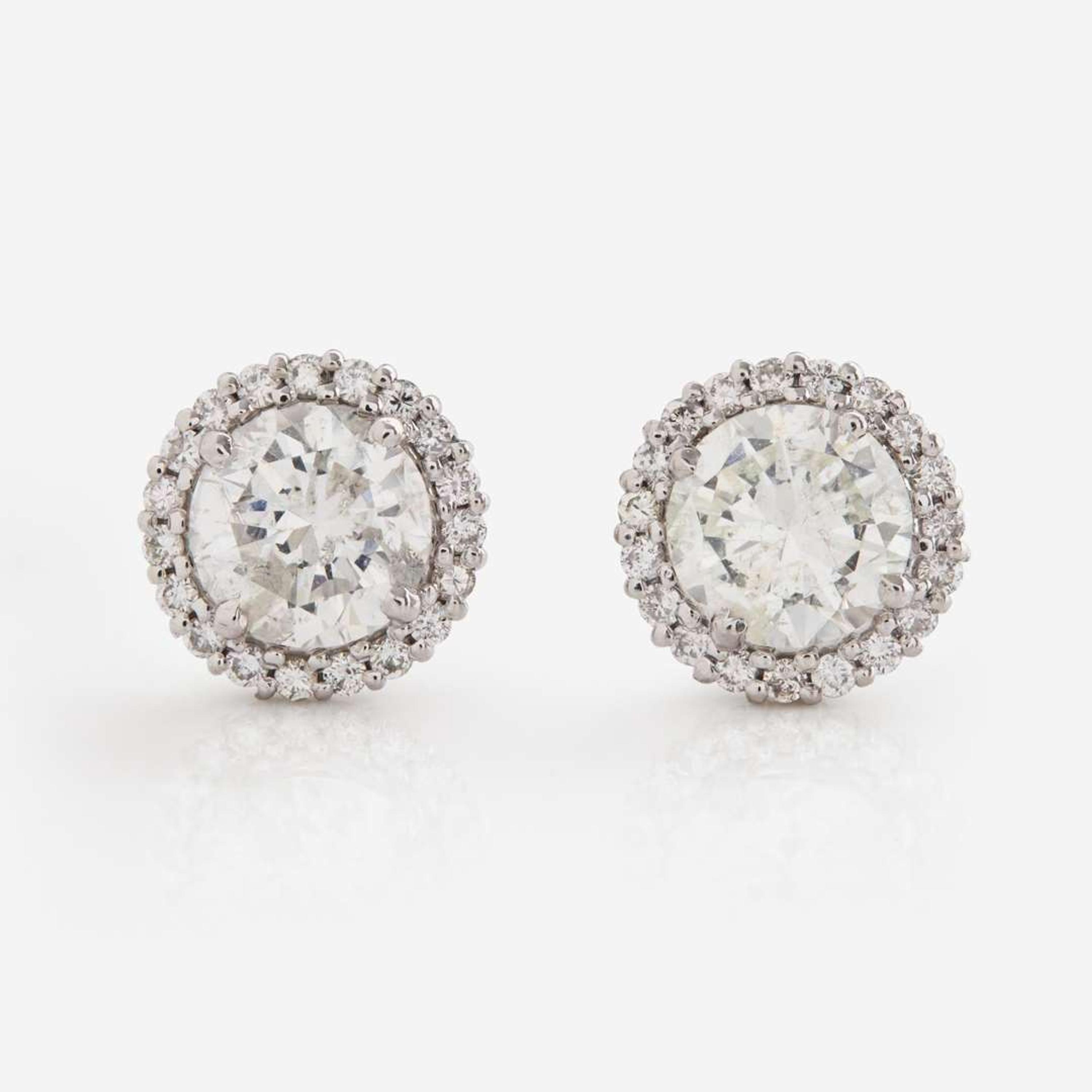 A Pair of 18K White Gold and Diamond Earrings