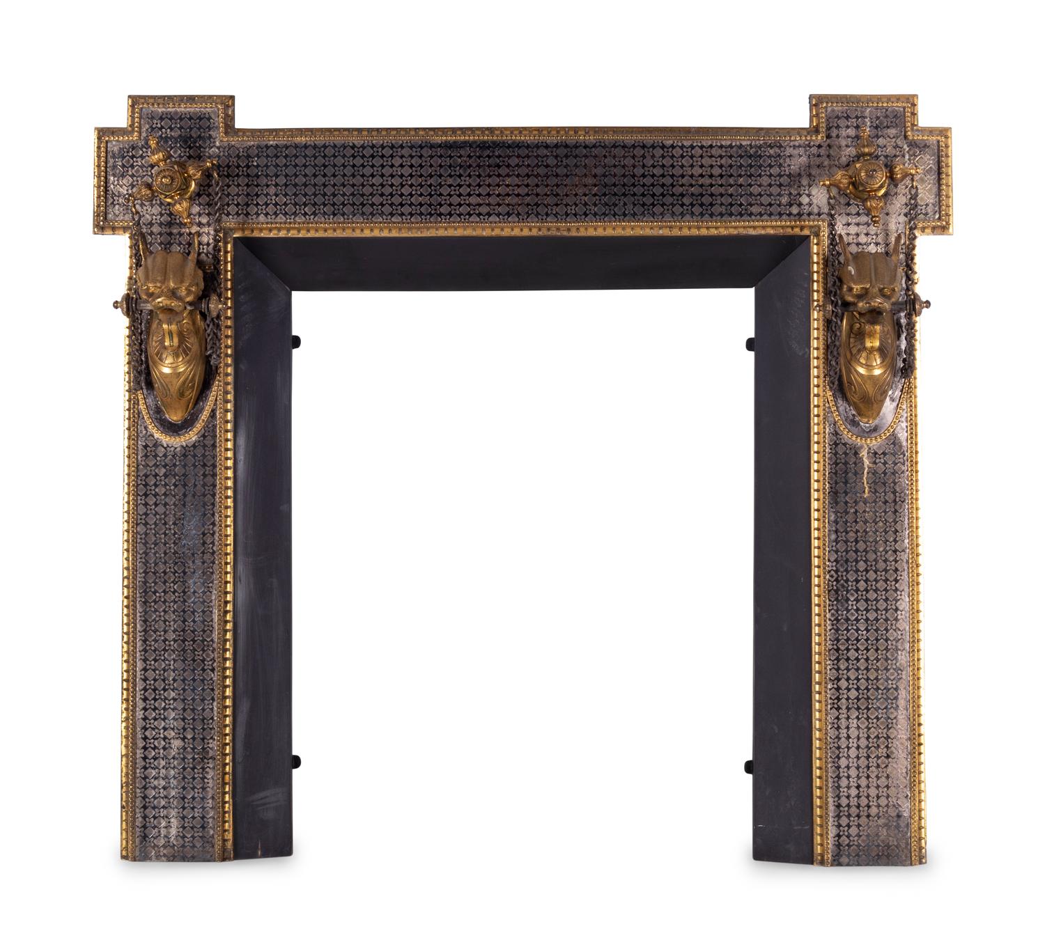 A Continental Silvered and Gilt Bronze Fireplace Surround