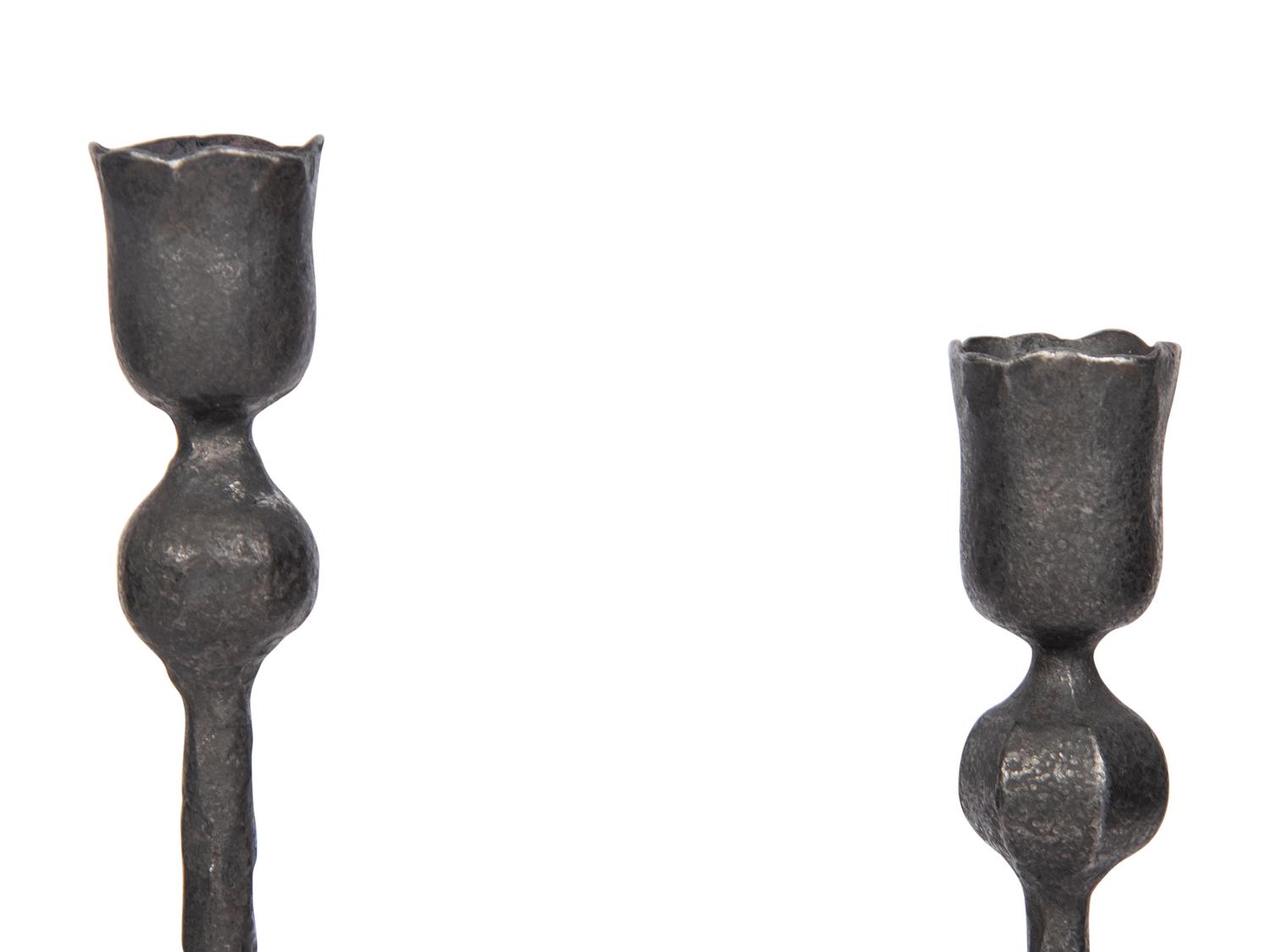 A Set of Eight Wrought Iron Candlesticks