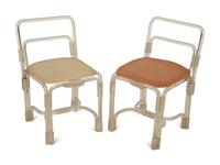 A Pair of Tubular Acrylic Low Back Chairs