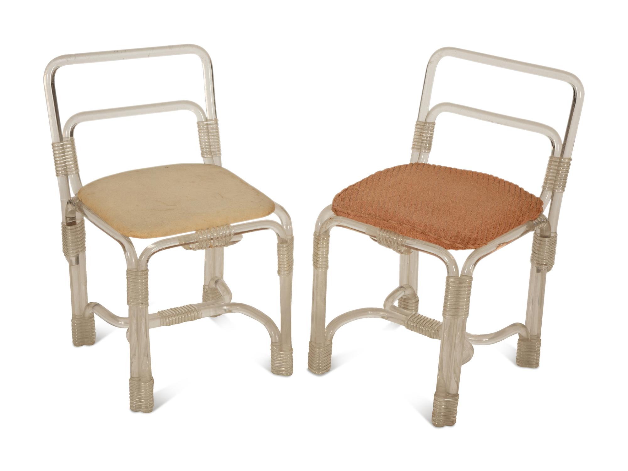 A Pair of Tubular Acrylic Low Back Chairs