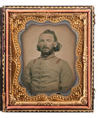 [CIVIL WAR]. Sixth plate ruby ambrotype of a bearded Confederate soldier, possibly from Alabama.