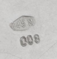 An Italian Silver Handled Cup, , raised on stepped foot, with applied foliate motif on front, and acanthus handle, marked "800" undersi