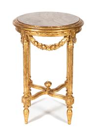 A Louis XVI Style Carved and Gilt Painted Pedestal Table Height 29 x diameter 19 1/2 inches. — EARLY 20TH CENTURY