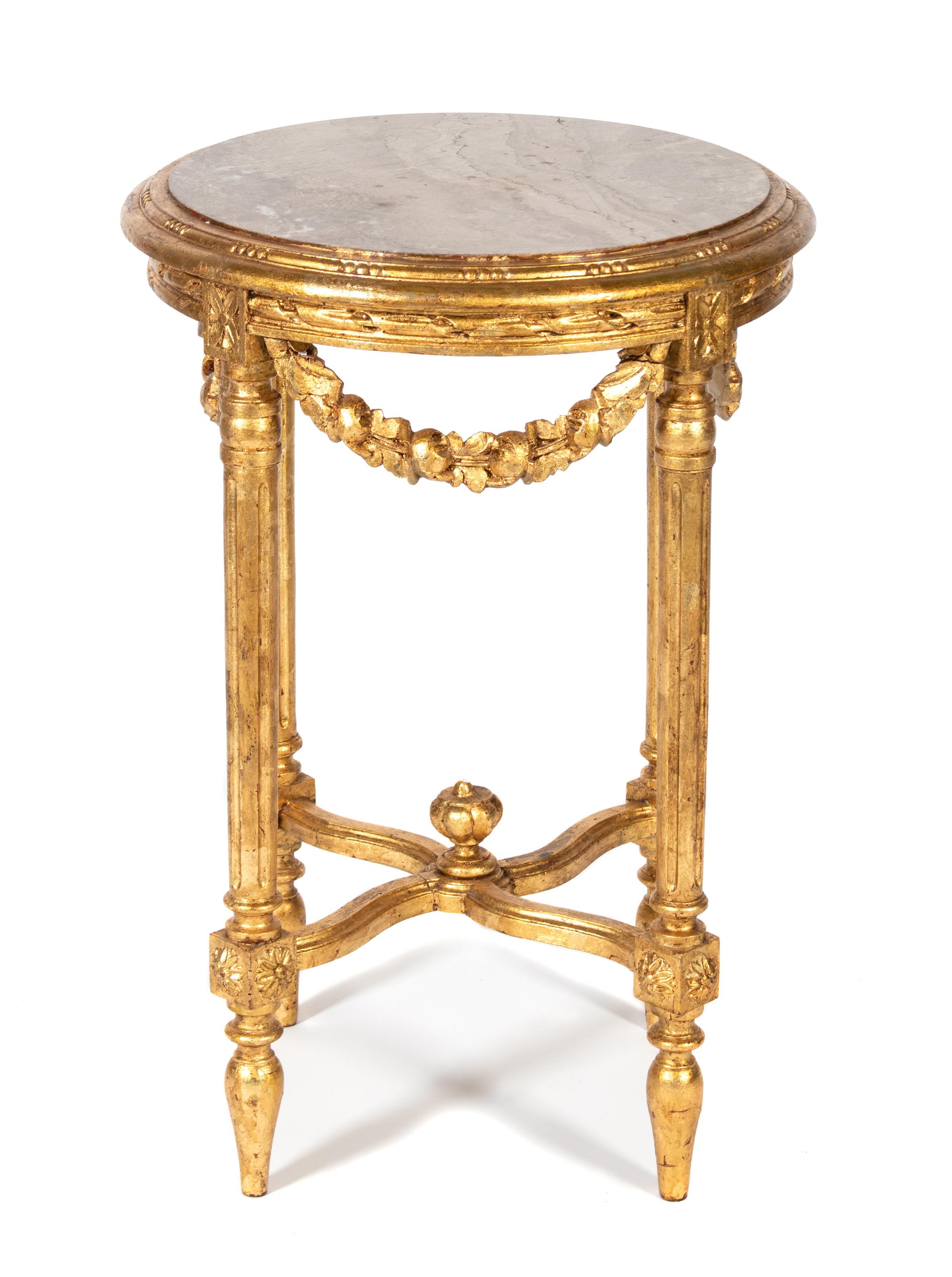 A Louis XVI Style Carved and Gilt Painted Pedestal Table Height 29 x diameter 19 1/2 inches. — EARLY 20TH CENTURY
