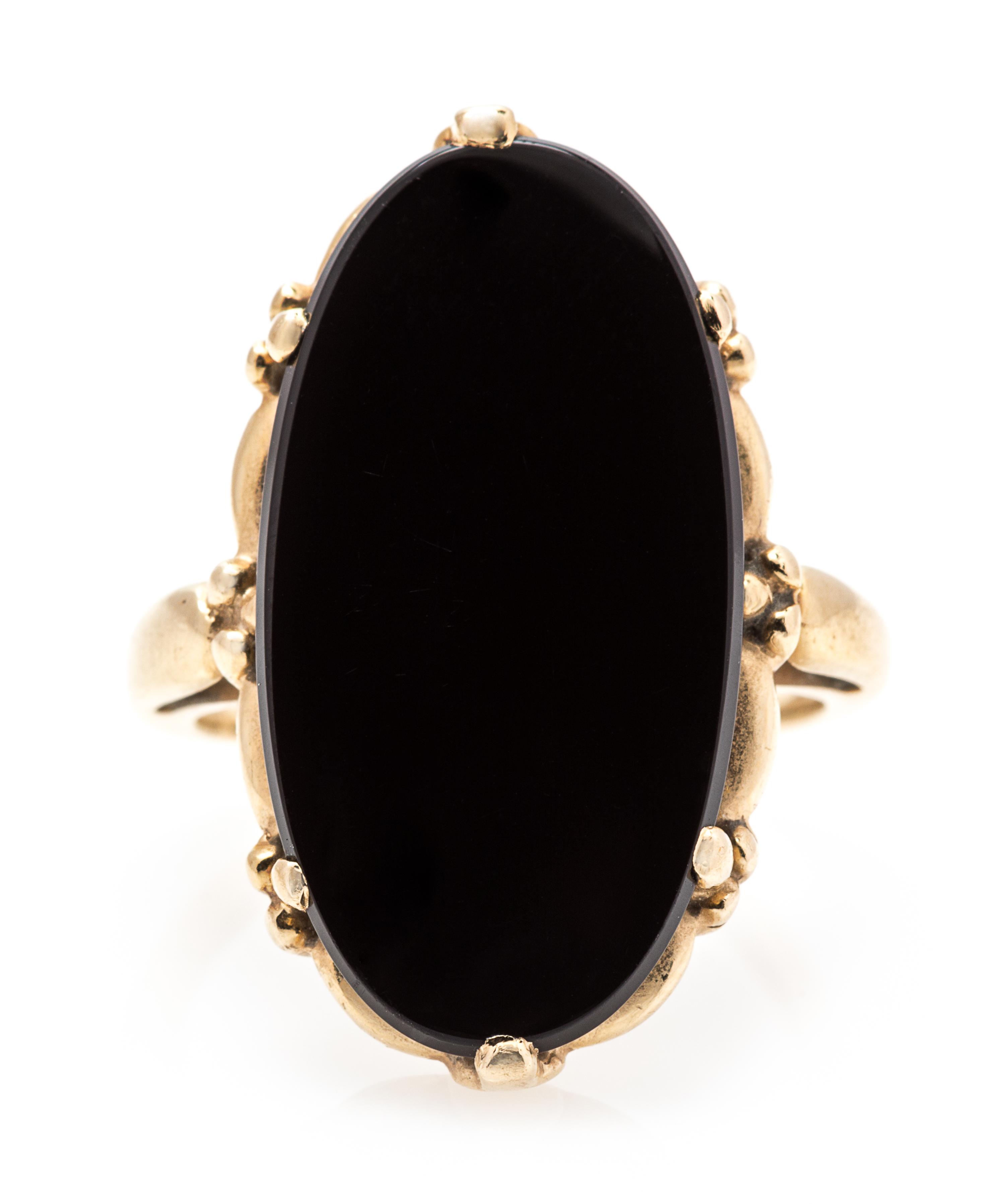 A Yellow Gold and Onyx Ring, 4.50 dwts.